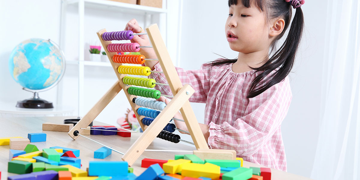 A girl working on a puzzle.